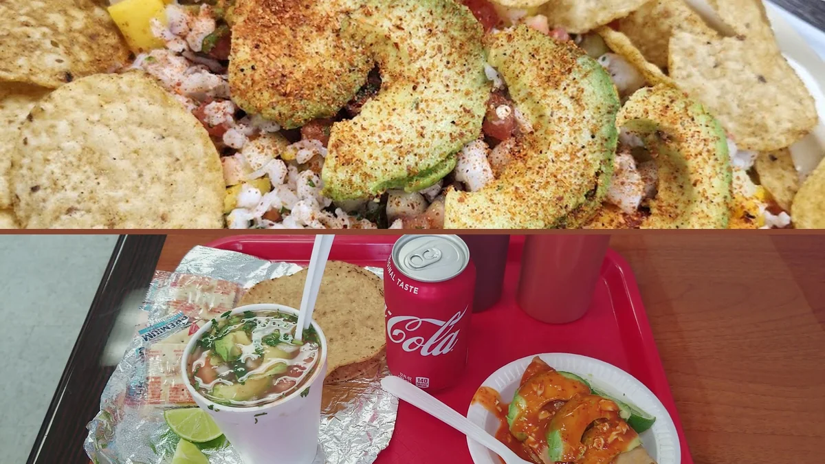 Colorful Mexican seafood spread in restaurant lighting.