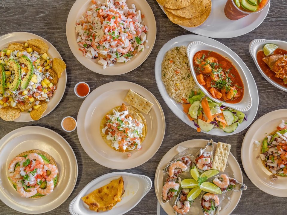 Ceviche, tacos, and cocteles on display.