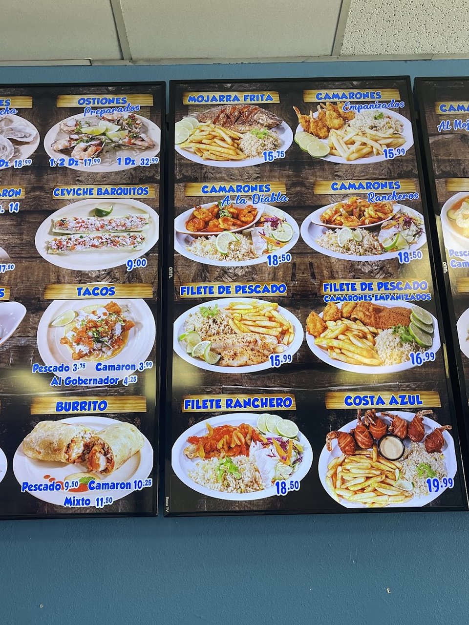 Menu board with tacos, ceviches, and cocteles.