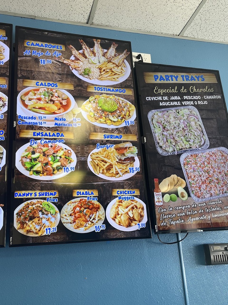 Seafood menu with burritos and platillos.